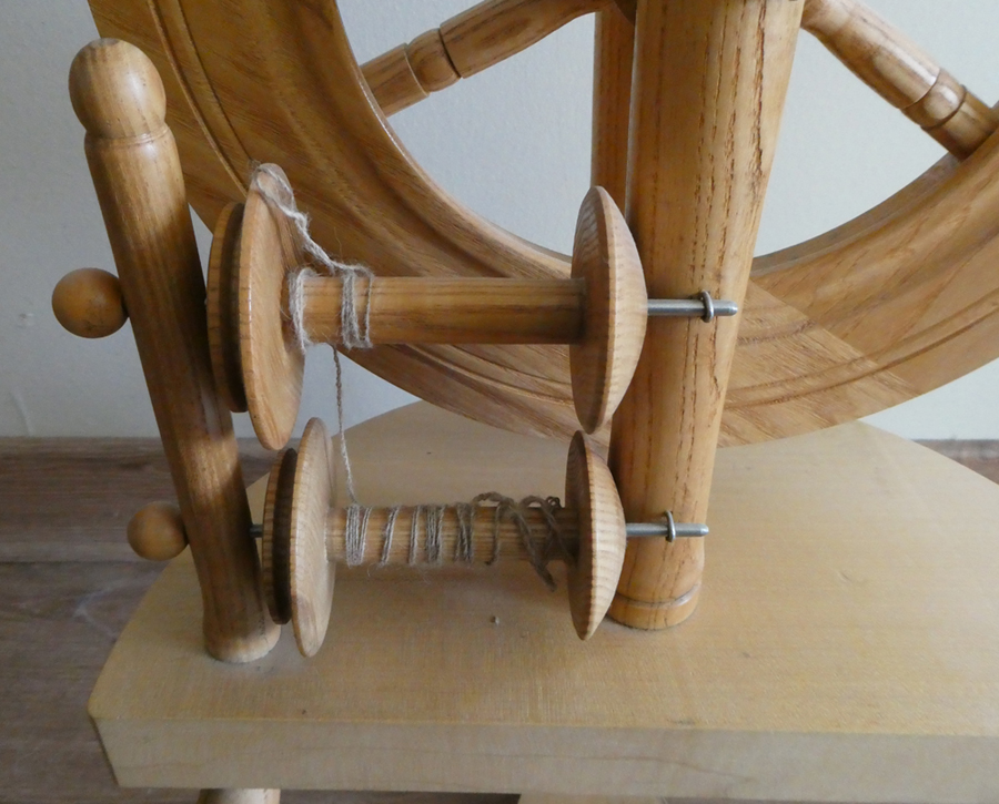 Hamish Poulson upright Shetland spinning wheel - bobbins